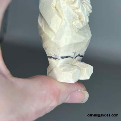 Sketched boots on hillbilly wood carving