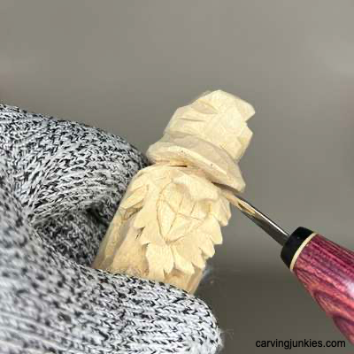 Carving the eye on a hillbilly wood carving