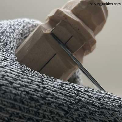 Wood carving the nose on a hillbilly