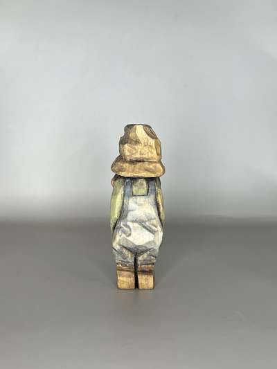 Back view of painted hillbilly from wood