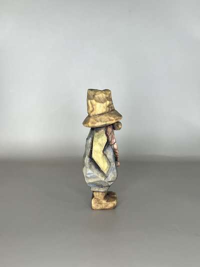 Right view of painted hillbillly carving