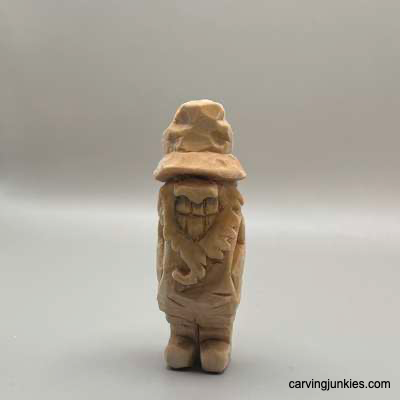 Back view of unpainted, carved hillbilly