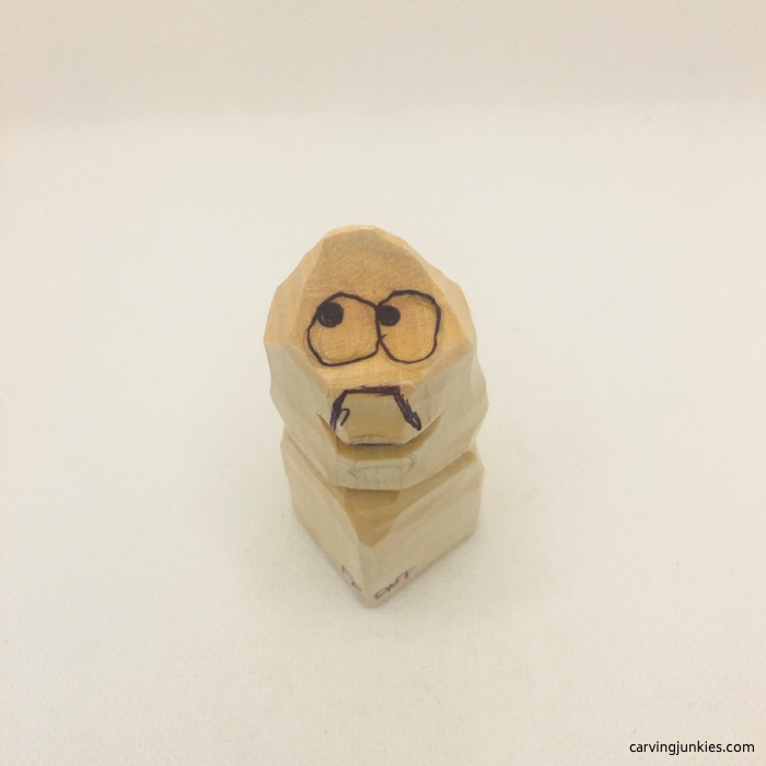 Cartoon face on wood