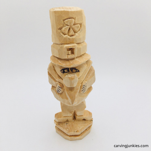 Adding eyes to leprechaun wood carving