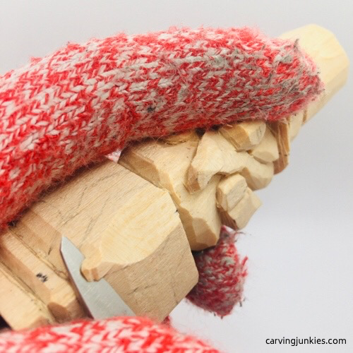 Carving body on wooden leprechaun