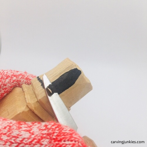 Slicing wood on leprechaun carving