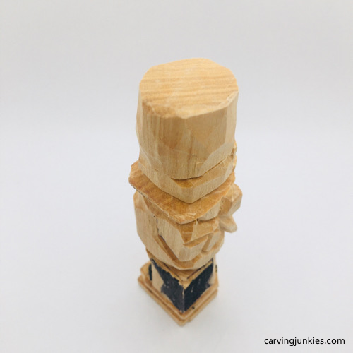 Side view of marked wood on leprechaun carving