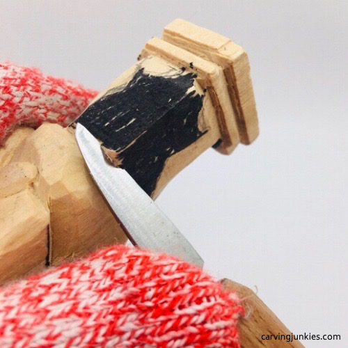 Narrow legs on leprechaun wood carving