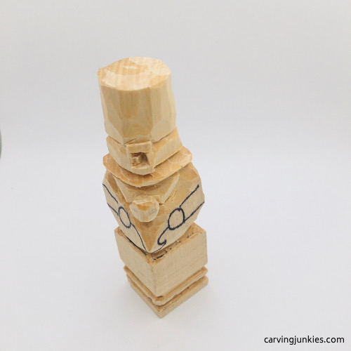 Carving cheeks on leprechaun wood carving