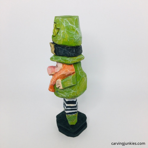 Left view of painted wooden leprechaun