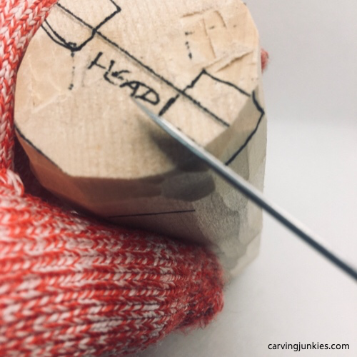 Cutting ears of lion wood carving