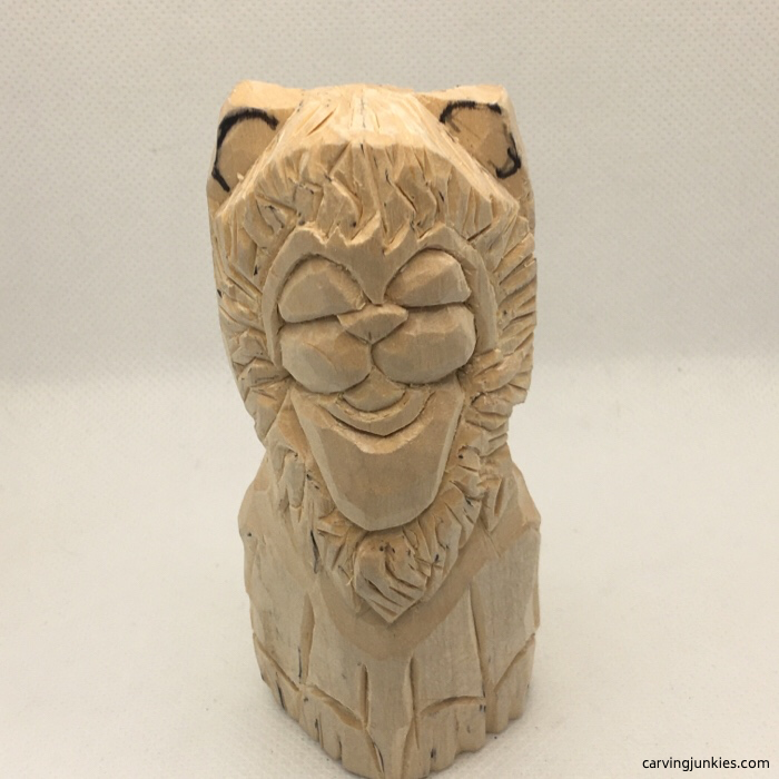 Progress photo of lion wood carving
