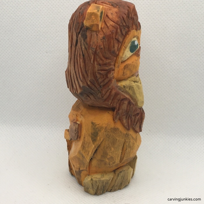 Right view of painted lion wood carving