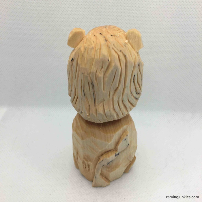 Back view of wooden lion before painting