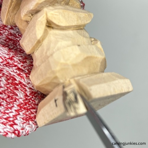 Splitting the legs of the little wood carving