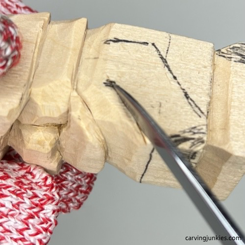 Splitting arm on the little wood carving