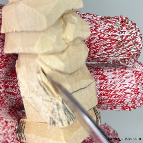 Pyramid cut on little wood carving