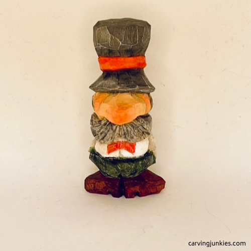 Painted front of small wood carving