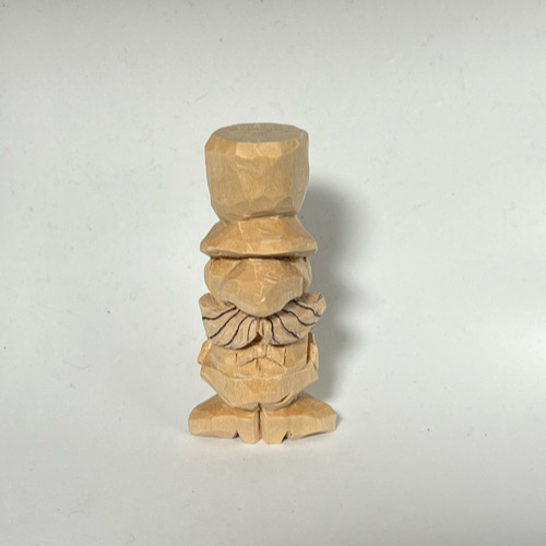 Lines are drawn to carve on little wood carving