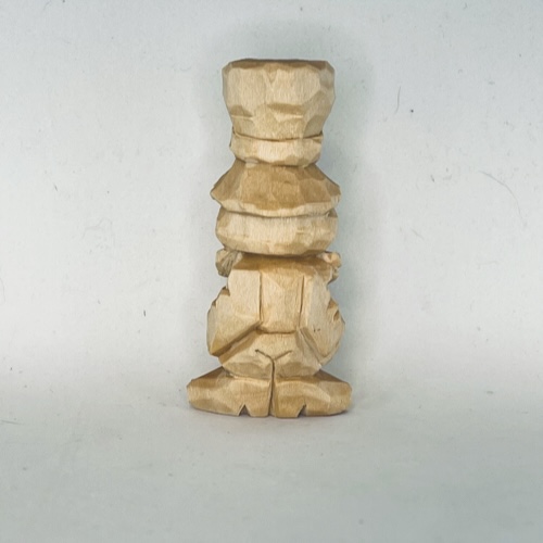 Back of unpainted little wood carving