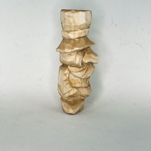 Right side of unpainted little wood carving