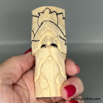 Nostrils are marked on wooden green man