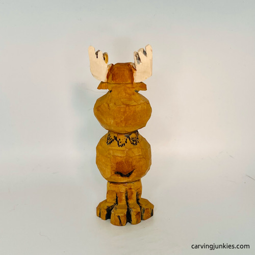 Back side of painted moose wood carving Back view of painted moose wood carving