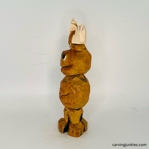 Left side of painted moose wood carving Left view of painted moose wood carving