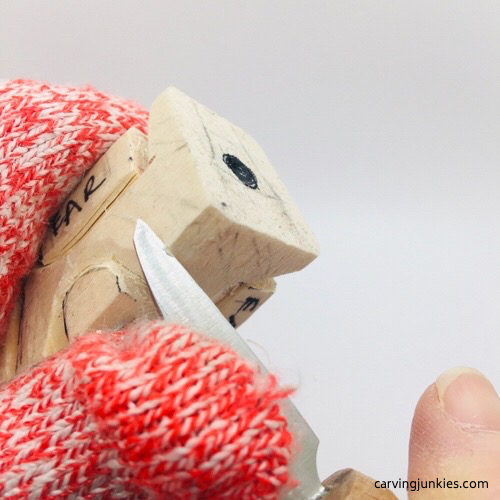 Carving face on mouse wood carving