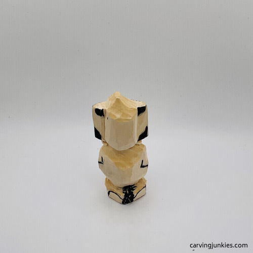 Back view of details on mouse wood carving