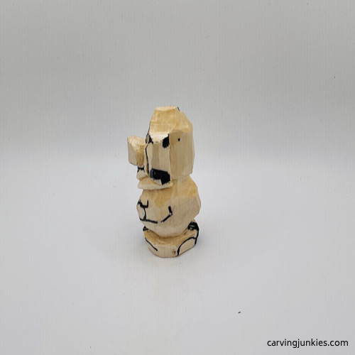 Left view of details on mouse wood carving