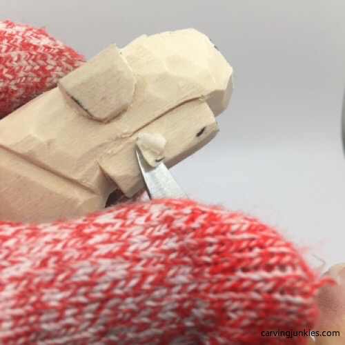 Shaping ear on mouse wood carving