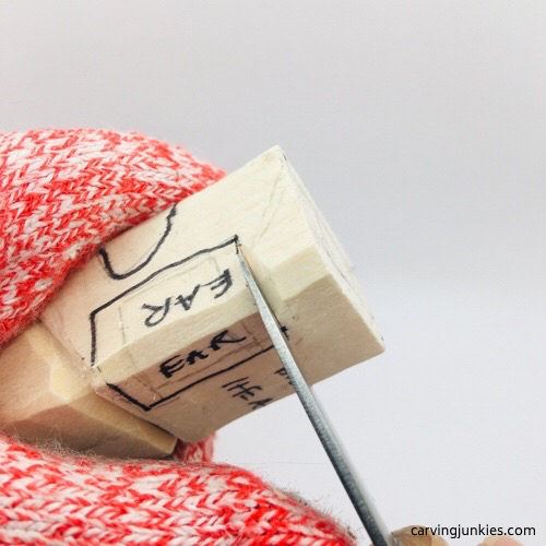 Separating ear on wood carved mouse