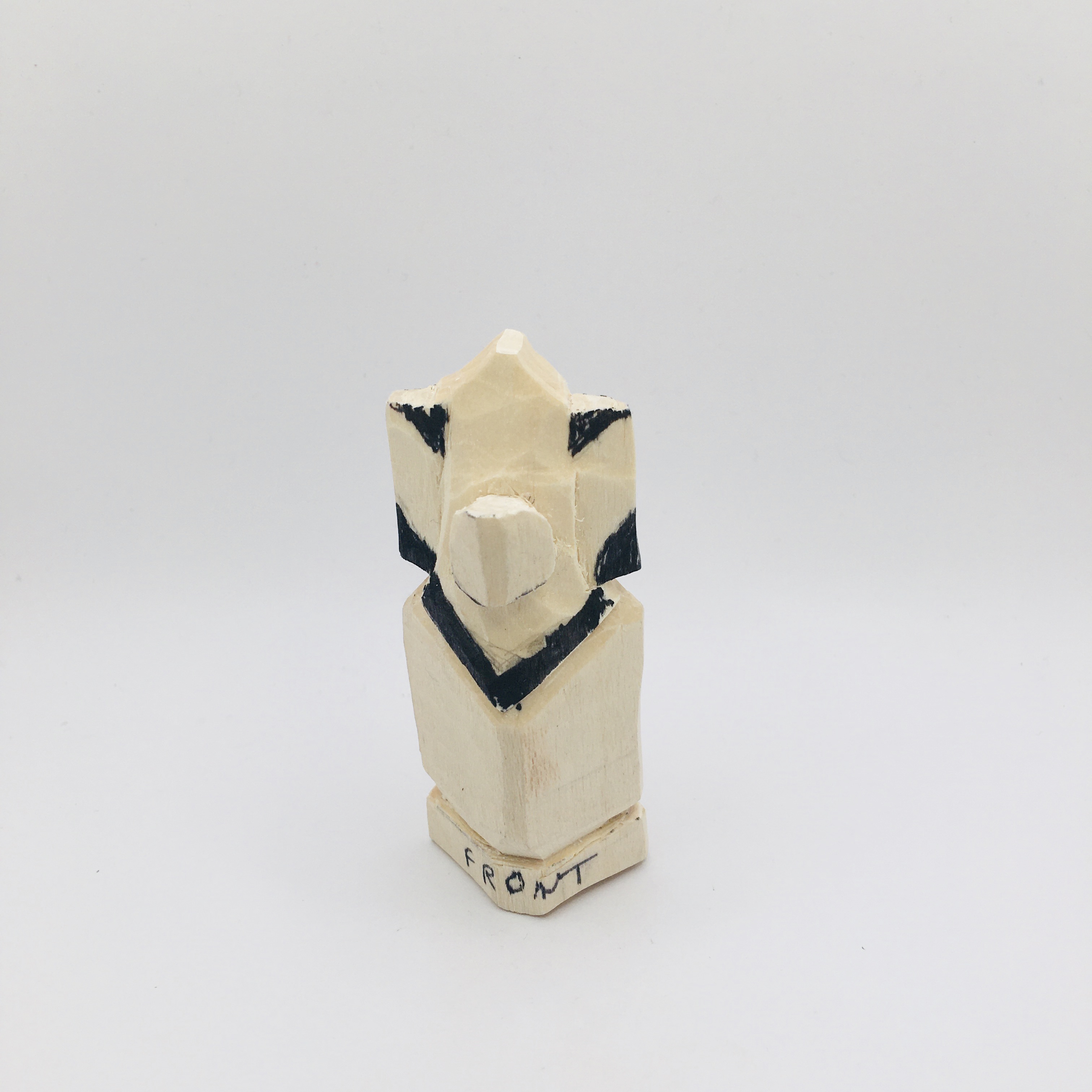 Shaped ears on mouse wood carving