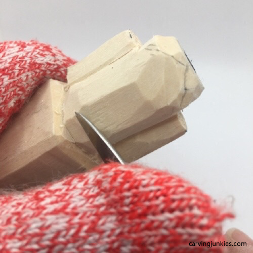 Shaping neck of mouse wood carving