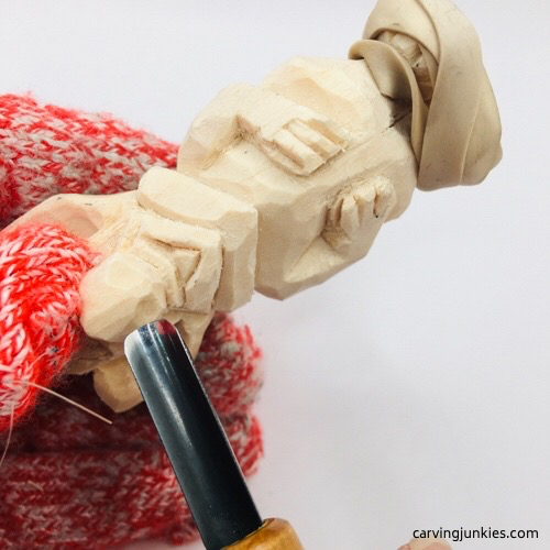 Shaping nostrils on mouse wood carving