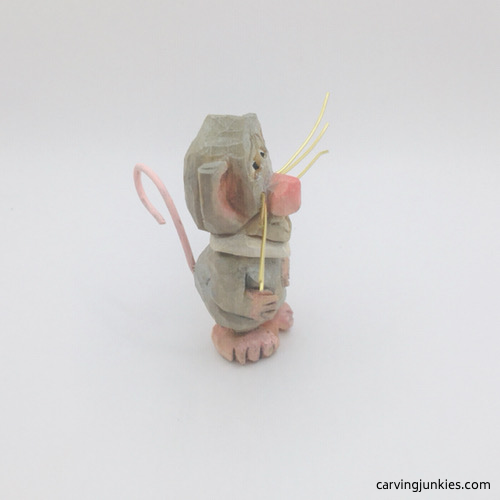 Right side of competed mouse wood carving Right view of painted mouse wood carving