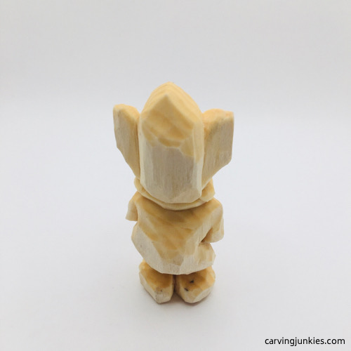 Back view of unpainted mouse wood carving