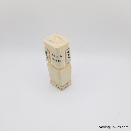 Back view of mouse wood carving