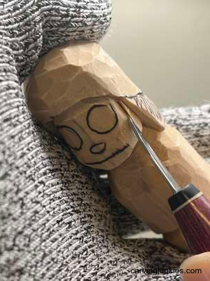 This mushroom monster might steal your heart Separating face on mushroom monster wood carving
