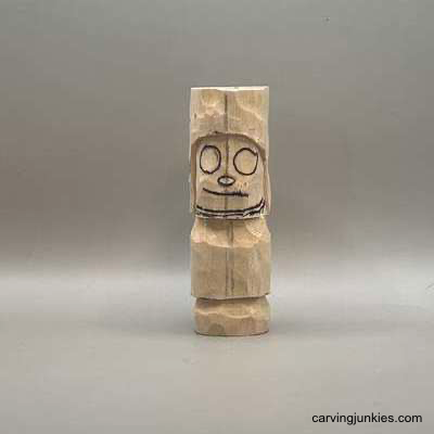 Whittle your way to a delightful forest creature Face is sketched on mushroom monster wood carving