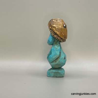 Click here to carve a goofy little mushroom monster Left view of painted mushroom monster wood carving