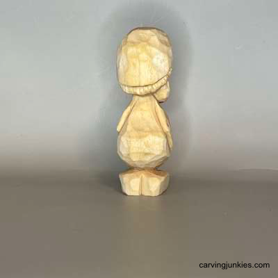 Your carving bench called—it wants this monster Back view of unpainted mushroom monster wood carving