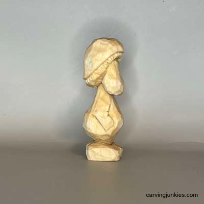 Say hello to your new favorite mushroom-shaped friend Right view of unpainted mushroom monster wood carving