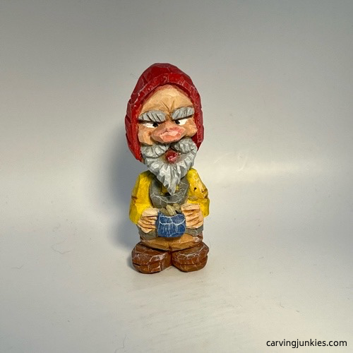 Front view of painted nisse wood carving