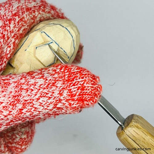 Cutting bridge of nose on nisse carving