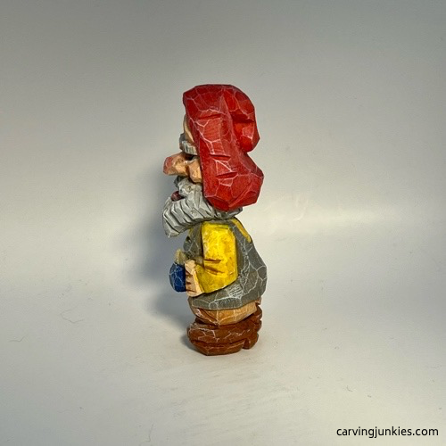 Left view of painted nisse wood carving