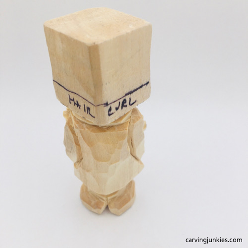 Carved arms on back of Oompa Loompa