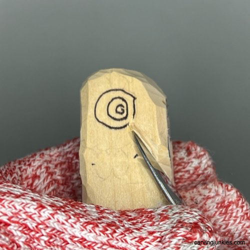 Carve a charming owl figure with our detailed tutorial. Separating the beak on owl carving