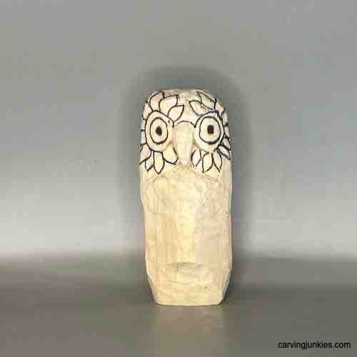 Transform a piece of wood into a stunning owl figure. Sketched feathers on owl carving